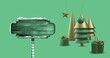 Image of christmas decorations with road sign on green background with copy space