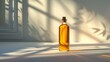 A bottle of liquor is sitting on a table in the sunlight