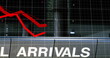 Image of a red graph, showing economical crisis on a grid over an airport digital composite image
