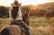 Woman in Cowboy Outfit Riding Horse