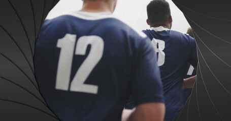 Sticker - Image of black shapes over male rugby players at stadium