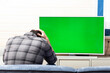 © Vitaliy - Shocked man on the couch watching tv. Bad news and Green screen concept