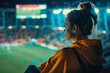 Woman Watching Soccer Game in Stadium