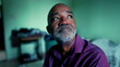 © Marco - One hopeful senior black man seeking faith during challenging times, close-up face of 50s person of African descent gazing at window in moody bedroom aspiring for optimism