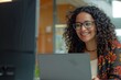 © Men Alchemy - Happy and smiling hispanic businesswoman typing on laptop, office worker with curly hair and glasses happy with achievement results, at work inside office building, Generative AI