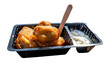 A portion of kibbeling with garlic sauce. Kibbeling is a Dutch snack consisting of battered chunks of fish