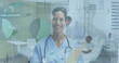 Image of infographic interface, smiling biracial female doctor with notepad standing in hospital