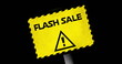 Image of yellow board with flash sale text and alertness sign over black background