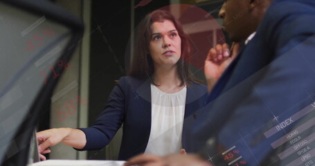 Canvas Print - Image of infographic interface and diverse serious businesswoman discussing with colleague