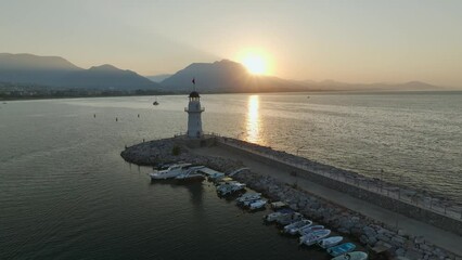 Wall Mural - Sunrise over Lighthouse and Marina from a drone, Alanya, Turkish Riviera on Mediterranean Coast, Antalya, Turkey