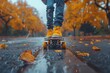 A dynamic low angle view of a person skateboarding among fallen leaves on a wet park path during autumn rain