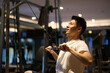 handsome Asian young man workout and exercise in gym. side view