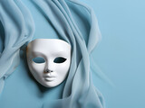 Fototapeta  - White mask with depressed expression on pastel blue background.