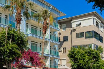 Wall Mural - Southern cityscape, view of buildings and houses in public places in Turkey, sunny summer day in a resort town