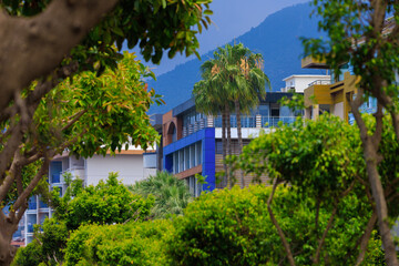 Wall Mural - Southern cityscape, view of buildings and houses in public places in Turkey, sunny summer day in a resort town