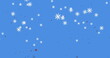 Image of snowflakes falling with red spots over blue background