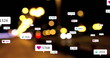 Image of social media icons and numbers over out of focus city lights