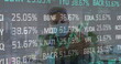 © vectorfusionart - Image of stock market data processing over biracial man using hand sanitizer at office
