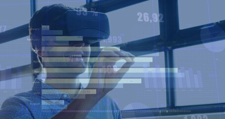 Poster - Image of numbers and statistics over caucasian man wearing vr headset