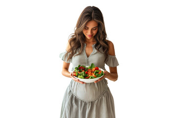 Smiling pregnant woman holding a bowl of fresh Salad, healthy vegetarian pregnancy