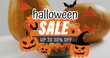 Image of halloween sale text with ghosts over orange carved pumpkins