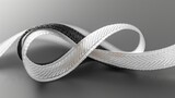 Fototapeta  - White and black ribbon, a piece of fabric in the form of a loop. Concept: symbol of support and social responsibility
