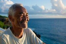 Senior asian man with a contented smile, enjoying a peaceful moment of solitude on a secluded balcony overlooking the ocean