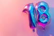 A whimsical birthday helium balloon shaped like the number 