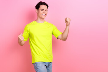 Canvas Print - Photo portrait of pretty teenager guy raise fists win lottery big sales wear trendy yellow outfit isolated on pink color background