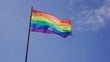 © Canary4stock - Rainbow LGBT flag waving outdoors with blue sky