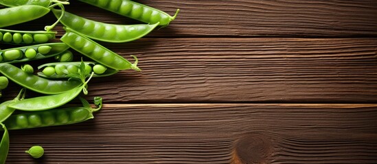 Poster - Fresh Green Peas Arranged Neatly on Rustic Wooden Table for Organic Farm Harvest Concept