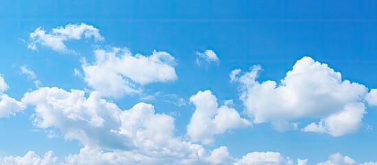 Poster - Tranquil Coastal Scene with Fluffy Clouds Over Pristine Beach on a Sunny Day