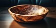 A wooden bowl resting on a wooden table. Suitable for various kitchen or dining concepts