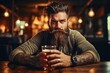 © Fotograf - A man sitting at a table with a glass of beer. Suitable for pub or bar concepts