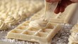  a close up of a waffle being drizzled with icing on top of other waffles.