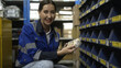 © pigprox - Female worker counting goods in warehouse