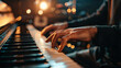 Close-up of hands gently playing piano with beautiful bokeh background