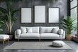 White sofa and posters, frames on gray wall. Interior design of modern living room.