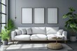 White sofa and posters, frames on gray wall. Interior design of modern living room.