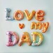 The words love my dad are creatively spelled out using inflated plasticine.