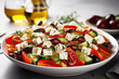 Classic vegetable salad with fresh olives, tomatoes, cucumbers, greek cheese feta and olive oil on gray background