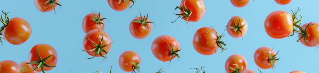 cherry tomatoes flying in summer blue sky. Fresh healthy food concept