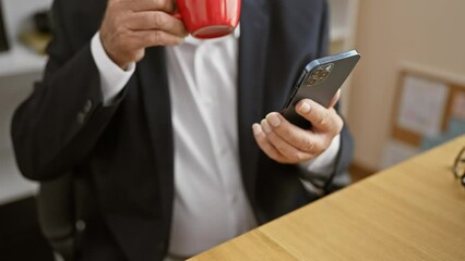 Sticker - Senior man boss takes a coffee breather, engrossed in office work on his smartphone, encapsulating the portrait of success