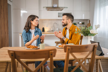 Wall Mural - Adult couple have breakfast and cup of coffee at home morning routine