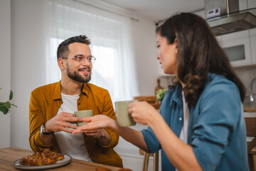 Wall Mural - Adult couple have breakfast and cup of coffee at home morning routine