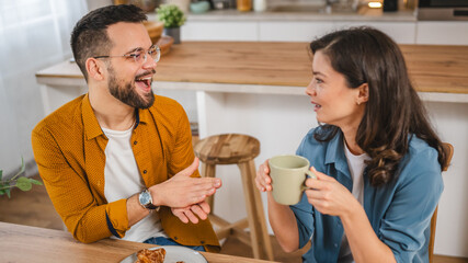 Wall Mural - Adult couple have breakfast and cup of coffee at home morning routine