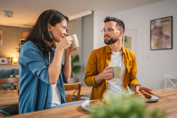 Wall Mural - Adult couple have breakfast and cup of coffee at home morning routine