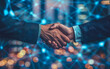 © Harry - Businessman handshake via virtual network. Close up of business people shaking hands.