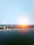Fototapeta Przestrzenne - Baltic sea beach with Zelenogradsk embankment. Kaliningrad region. Aerial view. Suset time