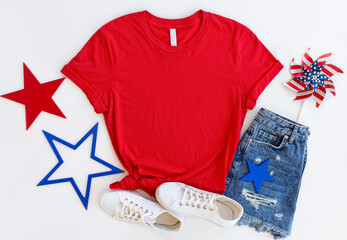 Wall Mural - Red T Shirt Mockup with 4th of July American Background. white t shirt mock up. Copy space blank red t-shirt flat lay 